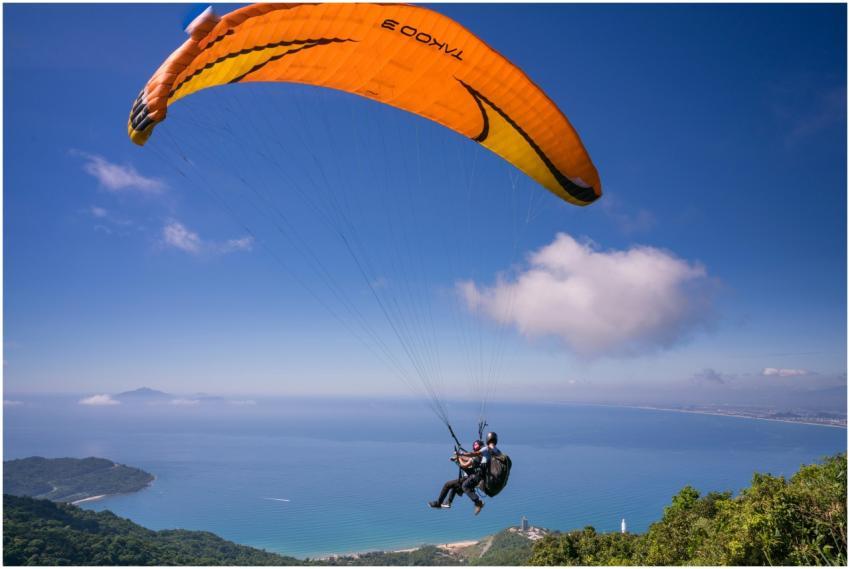 Experience the thrill of paragliding over a stunni