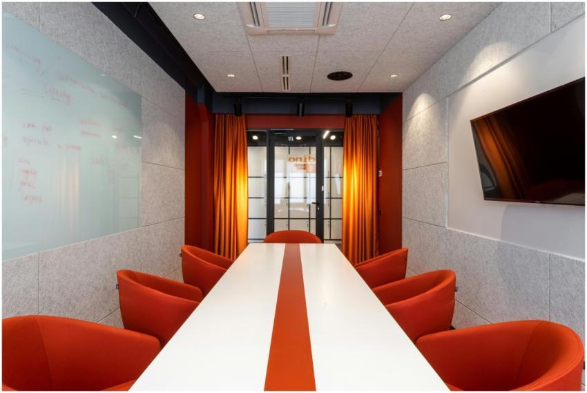Elegant and colorful conference room with orange c