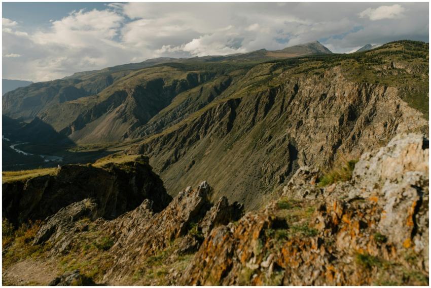 A stunning view of rugged mountains with lush gree