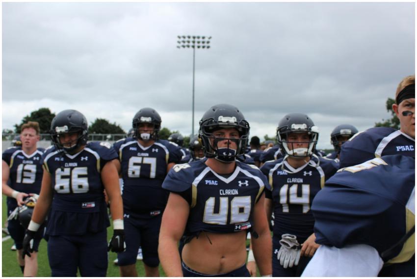 American football players in uniform and helmets g