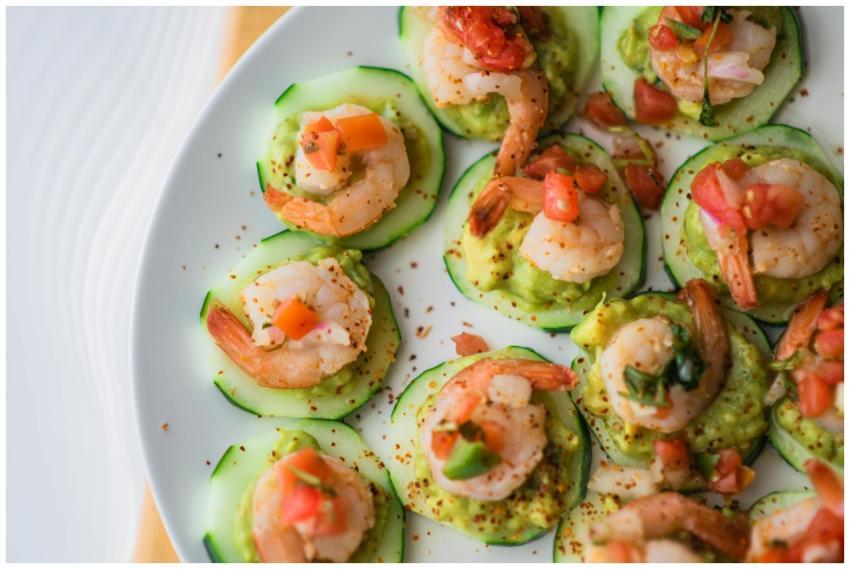 Delicious shrimp and guacamole on cucumber slices,