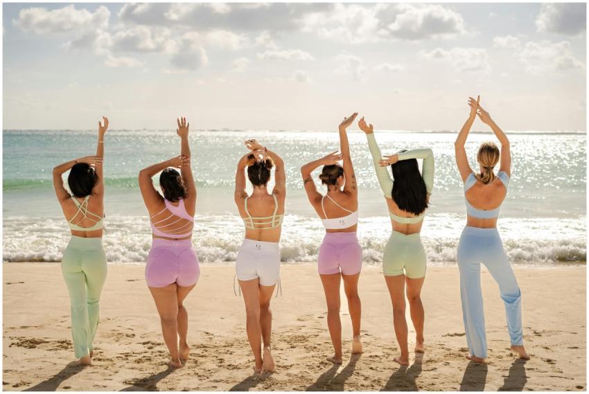 Five women in colorful activewear practicing yoga