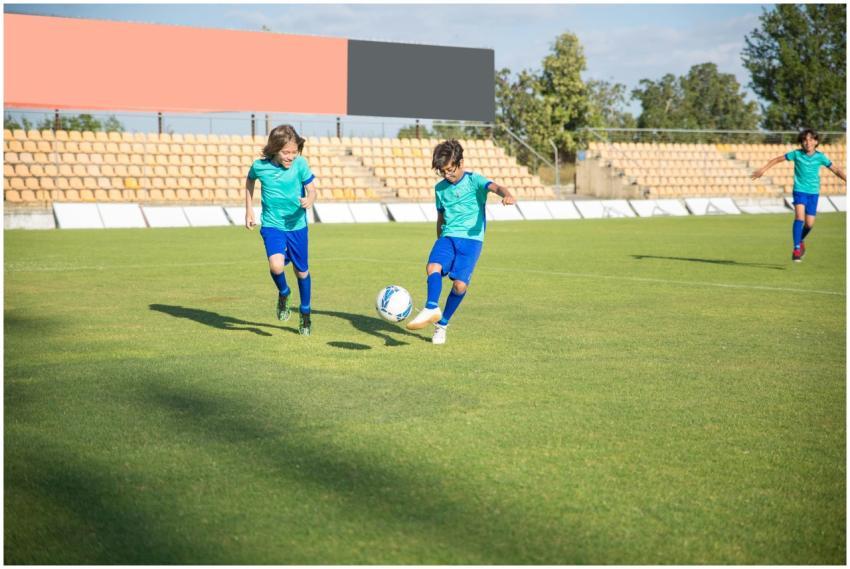 Children playing football on a sunny day in a Port