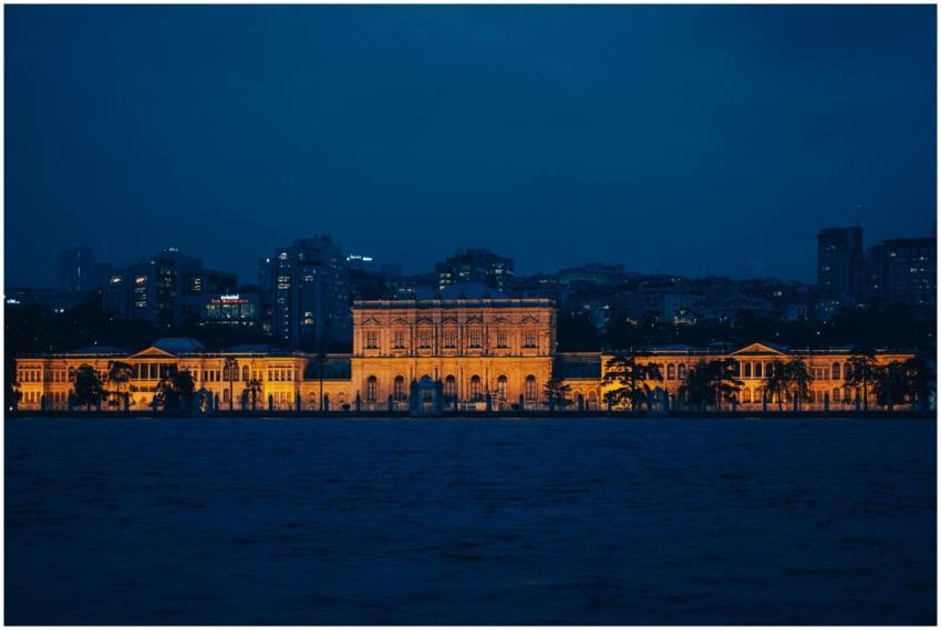 Dolmabahçe Palace glowing under the night sky in I