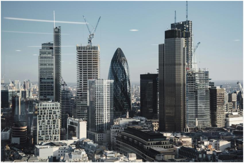 Various shaped modern skyscrapers with glass mirro
