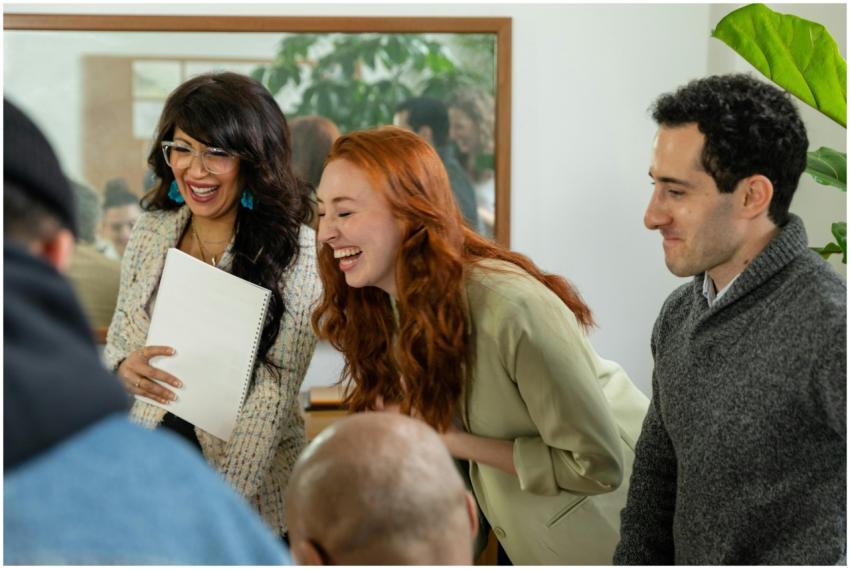 A diverse group of colleagues laughing and enjoyin