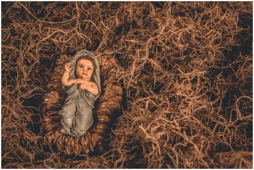 A nativity scene featuring a baby Jesus figurine s