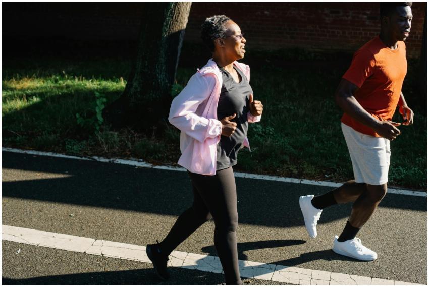 A dynamic image of a couple jogging on a sunny day
