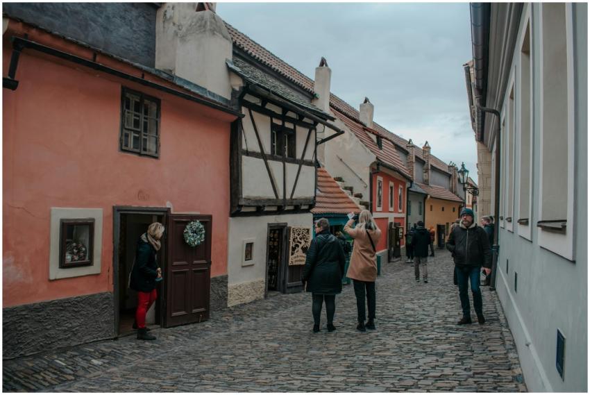 Charming scene on Golden Lane in Prague with peopl