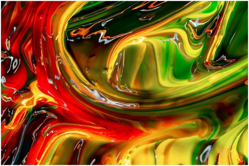 Vibrant and fluid abstract paint swirls creating a