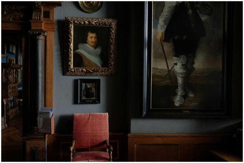 Interior of modern art gallery with portraits in c