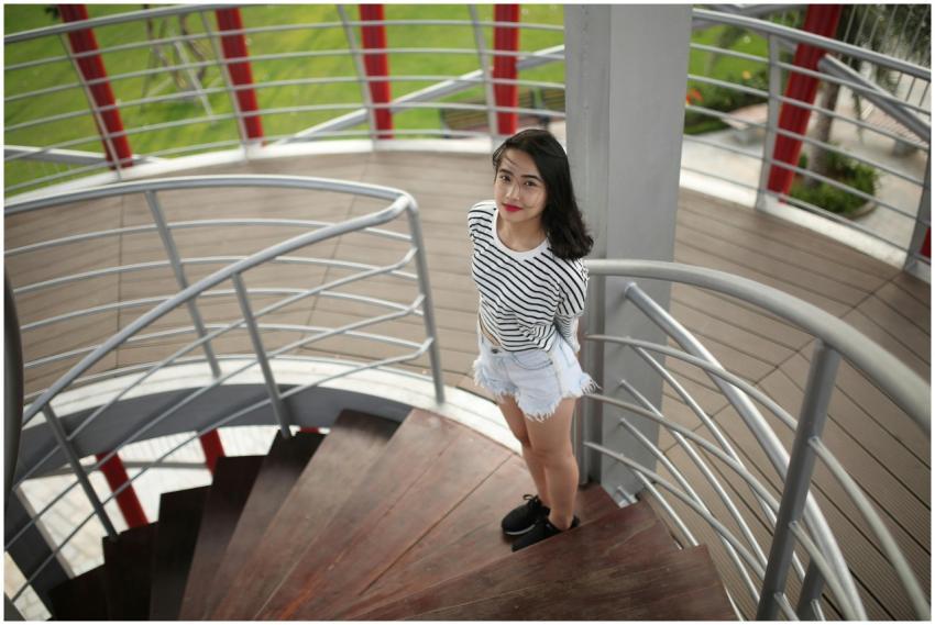 Fashionable young woman with red lips smiling on a