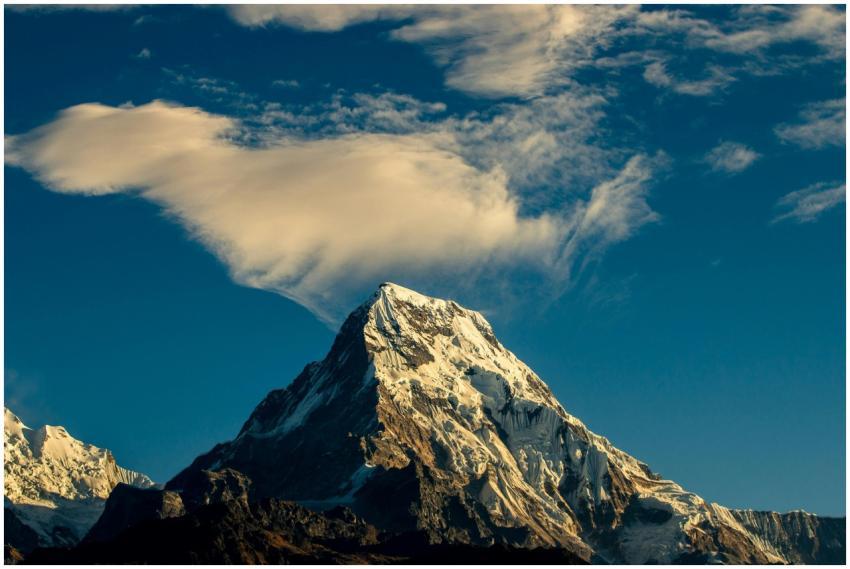 Stunning snow-capped mountain peak under a vibrant
