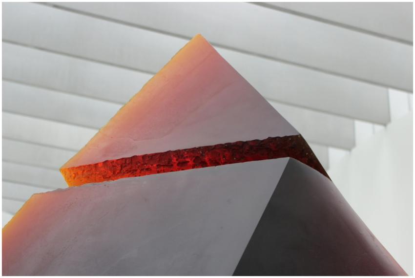 A striking abstract pyramid sculpture with bold co