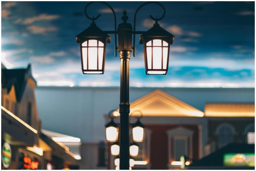 A tranquil street scene with illuminated lamps and