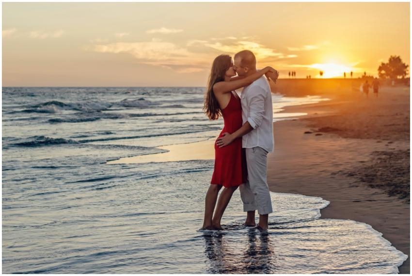 A couple in love embraces at the seaside during a