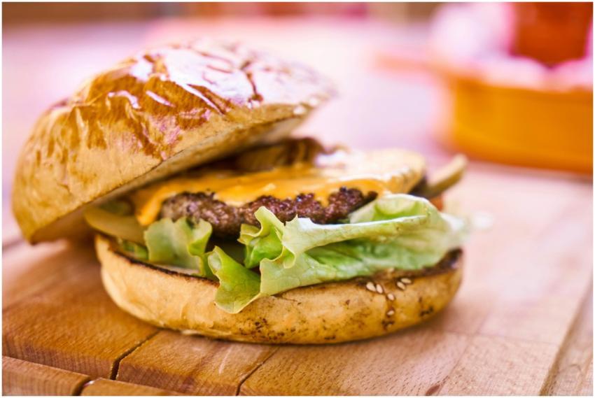Close-up of a delicious cheeseburger with melted c
