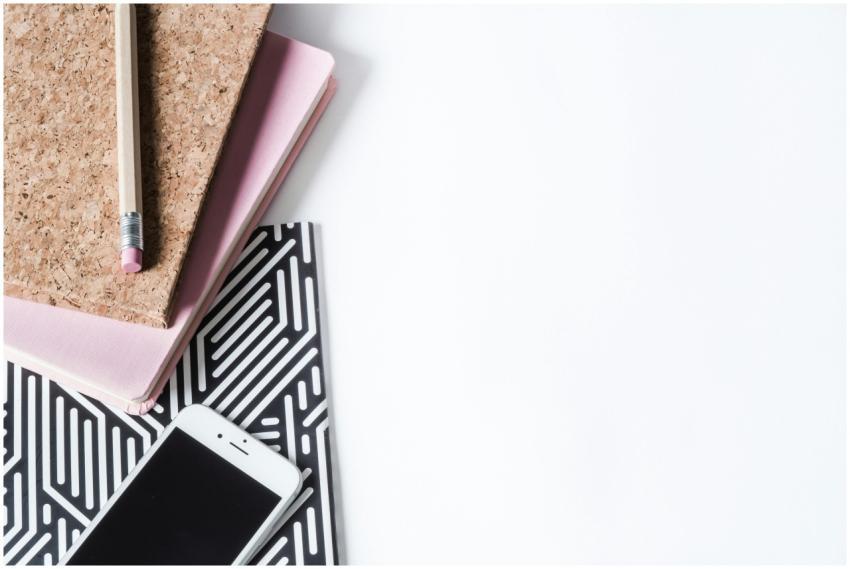 Stylish flat lay of a creative workspace with note