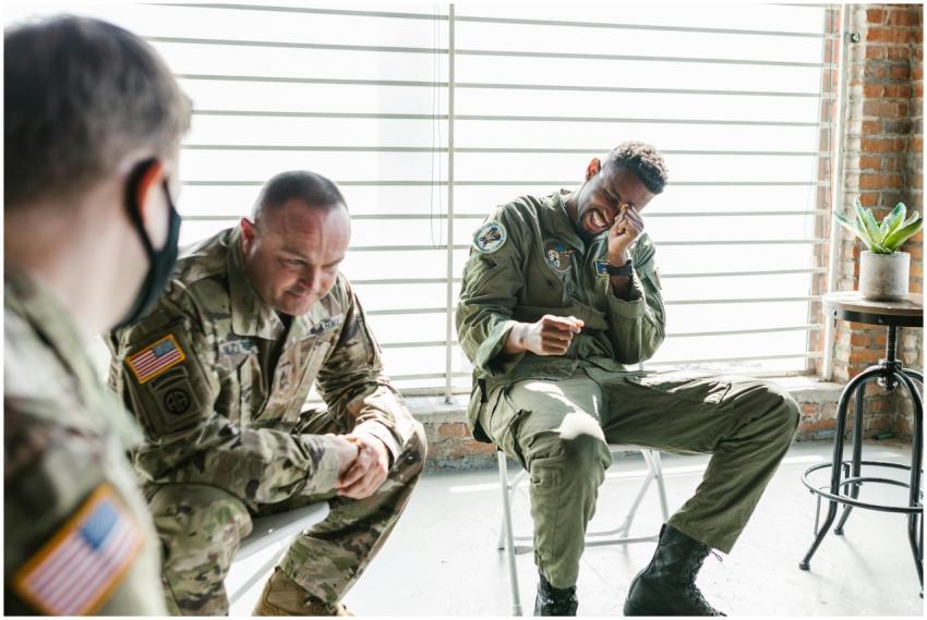 Veterans share a light moment during a group thera