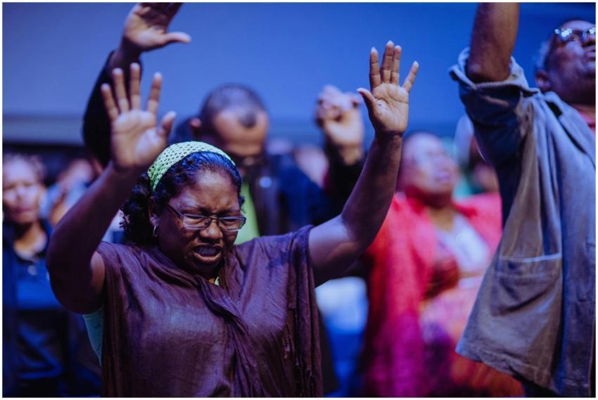 People gathered in a heartfelt prayer meeting, exp