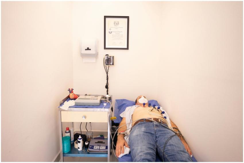 Patient lying down for an electrocardiogram in a c