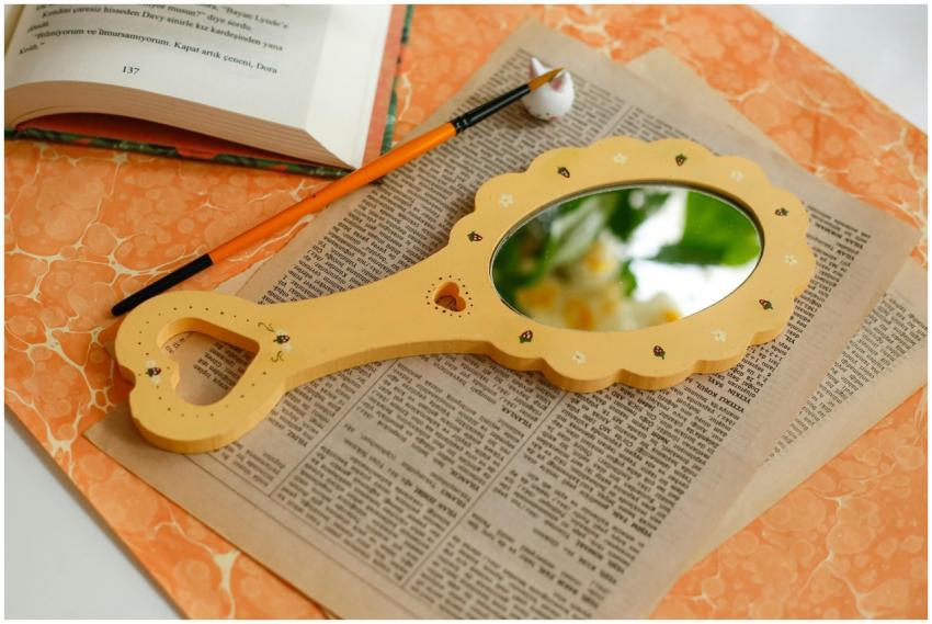 Creative flat lay featuring a decorative mirror, b