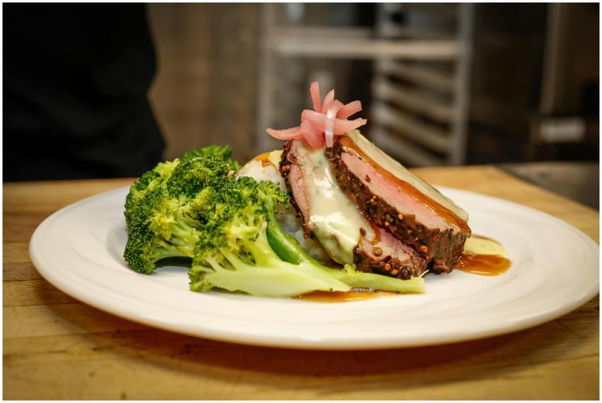 Delicious gourmet meat dish with broccoli served e