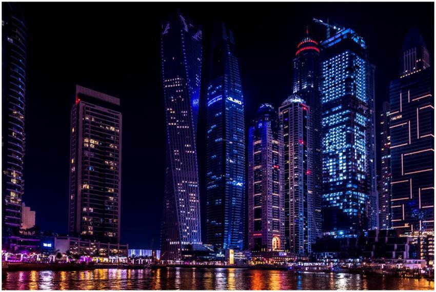 Illuminated skyscrapers of Dubai Marina at night,
