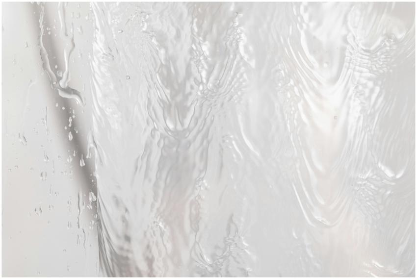 Close-up of rippling water surface texture with li