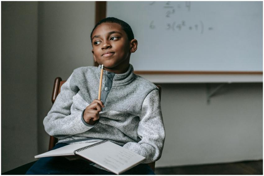 Concentrated African American boy in casual outfit