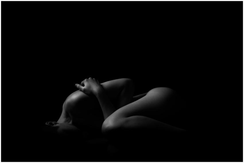 Artistic black and white nude photograph featuring
