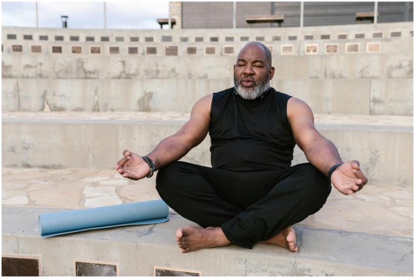 Senior man meditating outdoors promoting tranquili