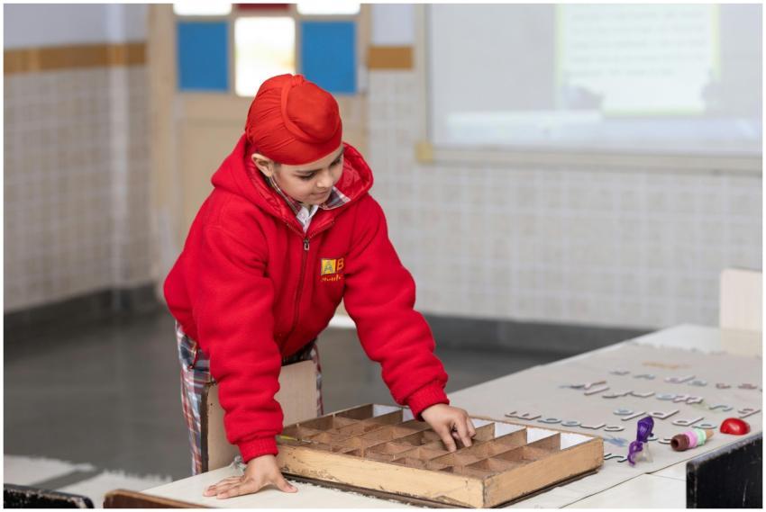 A young student focused on a classroom activity, e