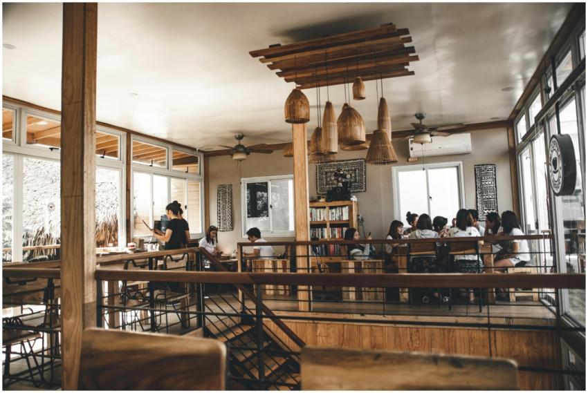 A modern café interior featuring a group dining, w