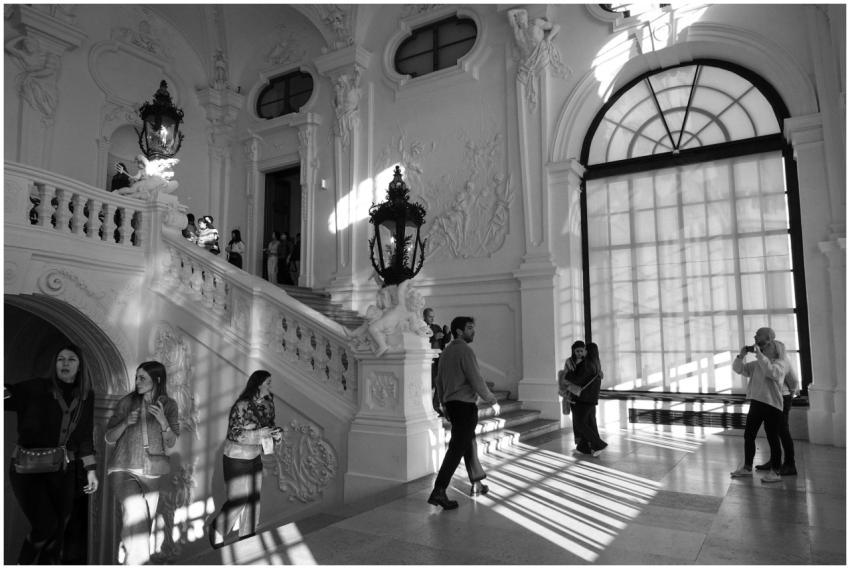 Monochrome image capturing visitors in a grand Bar