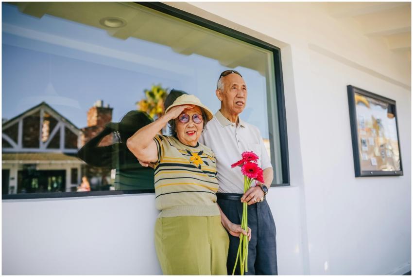 Asian senior couple enjoying a sunny day outside w