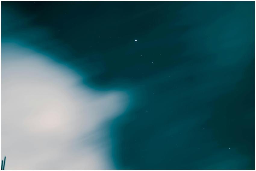 A mesmerizing view of the night sky with clouds an