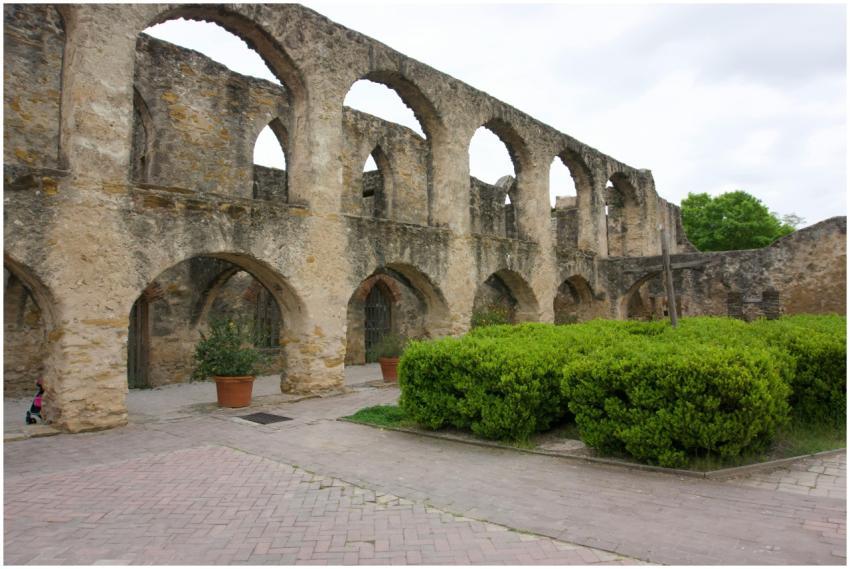 Explore the historic arched stone facade at San An