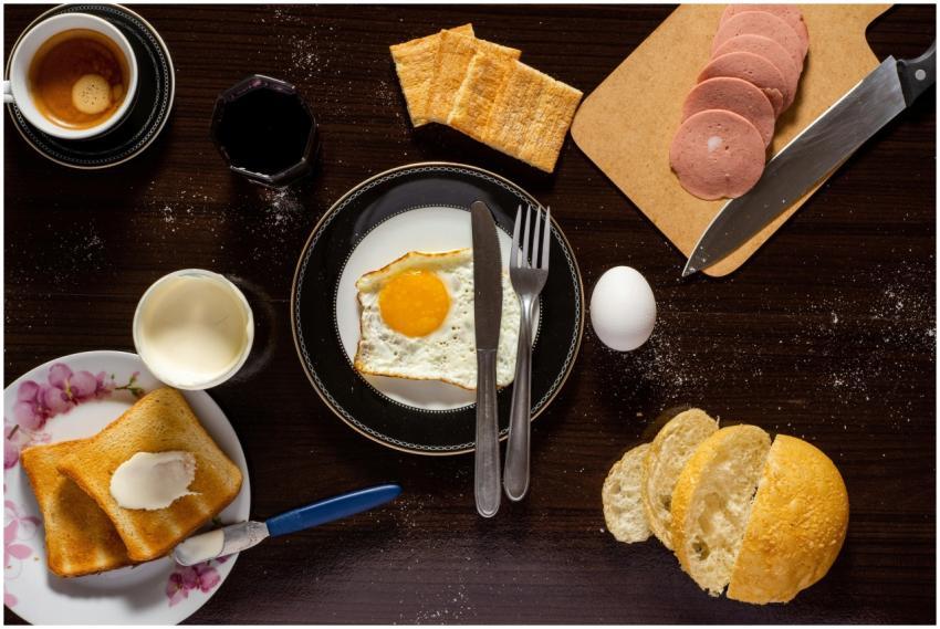 A top view of a breakfast spread with eggs, toast,