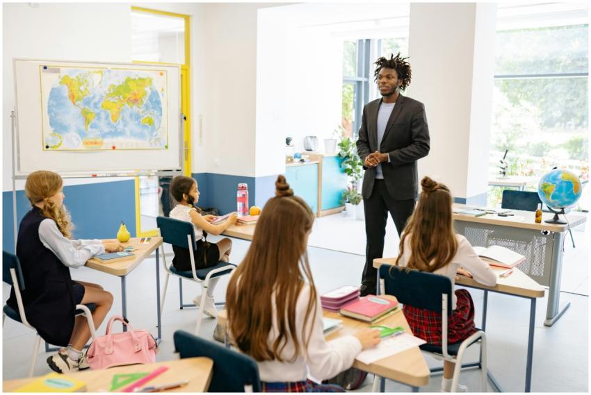 Teacher engaging with students in a bright, modern