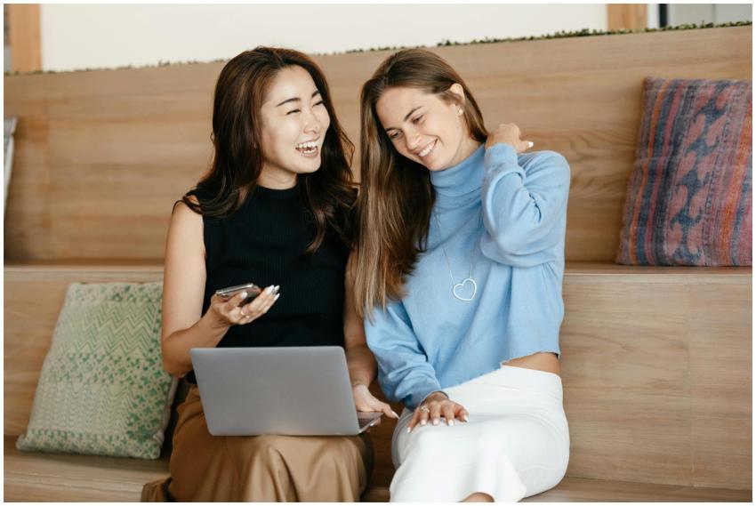 Cheerful young multiracial friends smiling and sur