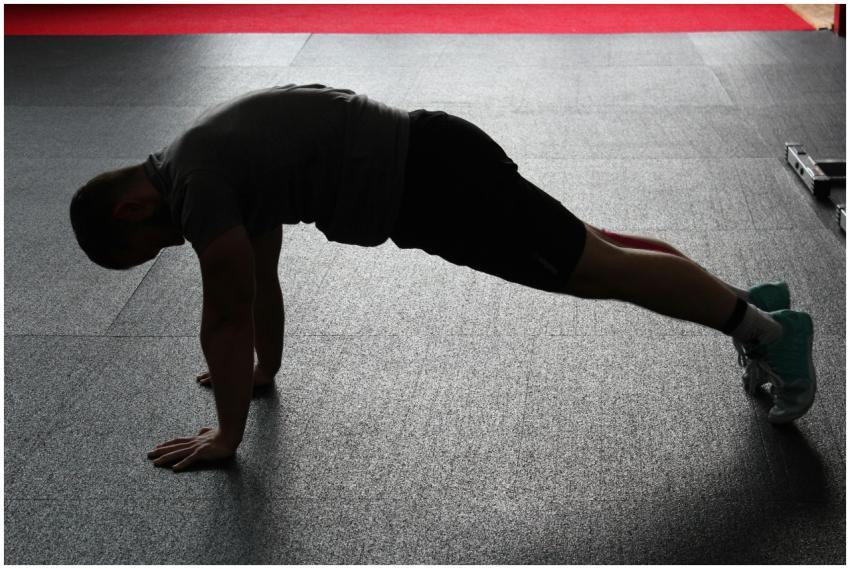 An athlete demonstrates a perfect push-up form in