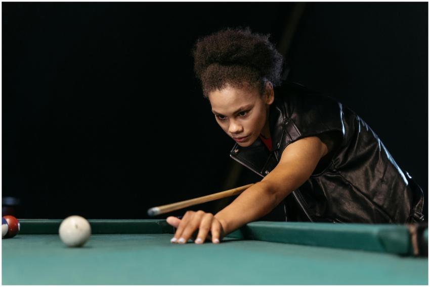 An African American woman intensely focusing on a