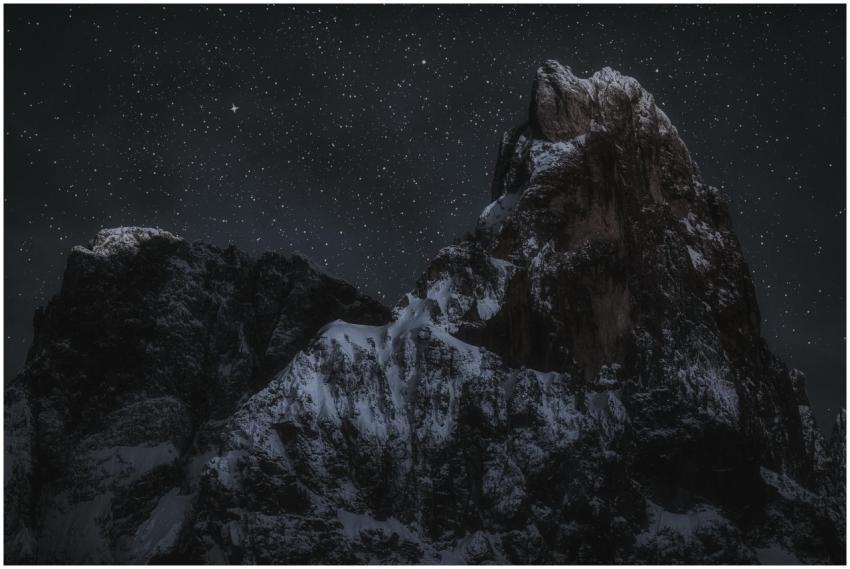 Majestic snow-capped mountain under a serene starr