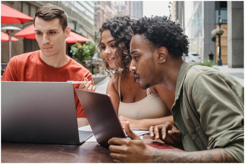 Concentrated young multiracial students sitting in