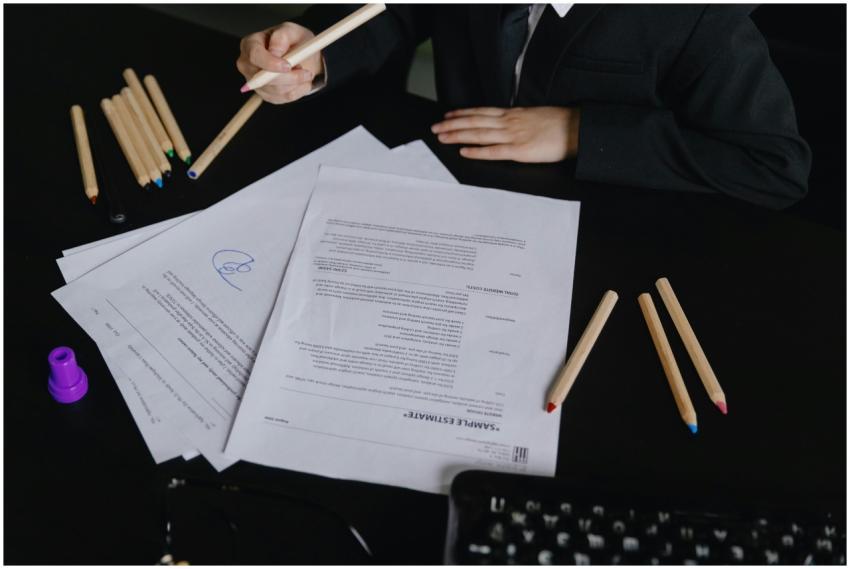 A business professional in formal attire reviews d