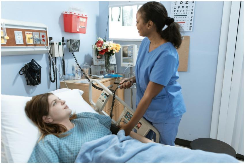 Nurse providing care to a patient in a hospital ro
