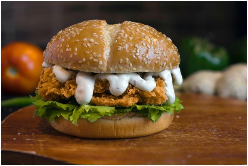 Delicious crispy chicken burger with lettuce and c