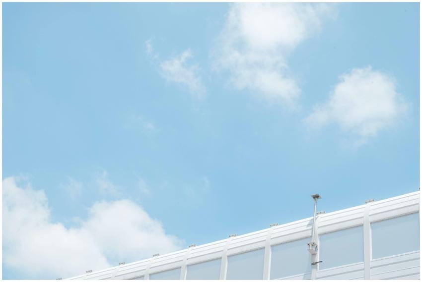 Minimalist image of a security camera against a br