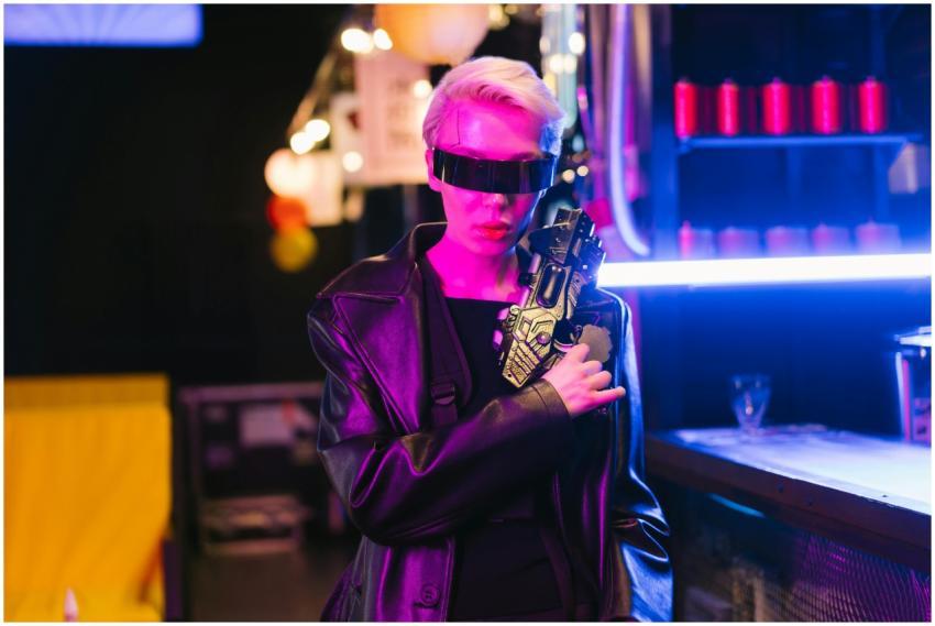 Stylish cyberpunk woman in dark room with futurist